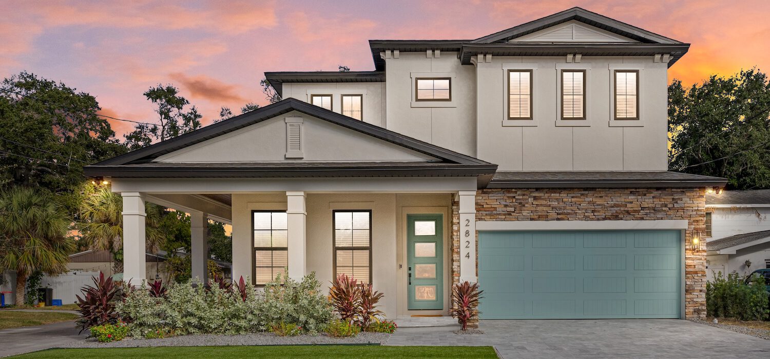 Beautiful Custom Home at Sunset with Blue Garage Door | WinWay Homes Pinellas County