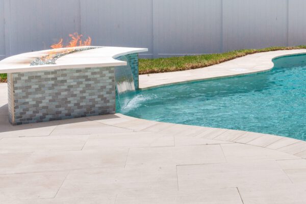 WinWay Homes Pool Water Feature with Fire Feature, Waterfall Edge, Tile Detail & Light Paver Decking