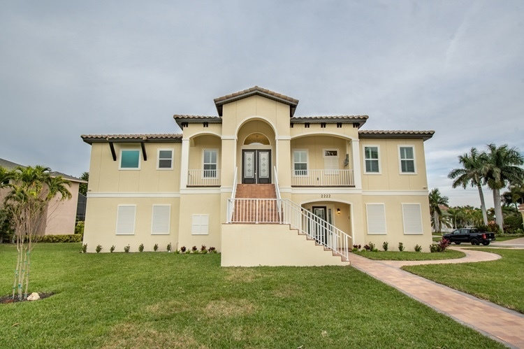 A Coastal Modern 2-Story Custom Home with Lawn & Palm Trees | WinWay Homes Pinellas County