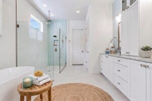 Spa Style Master Bath in White and Pale Blue with Glass Framed Shower, Window and Double Vanity from WinWay Homes