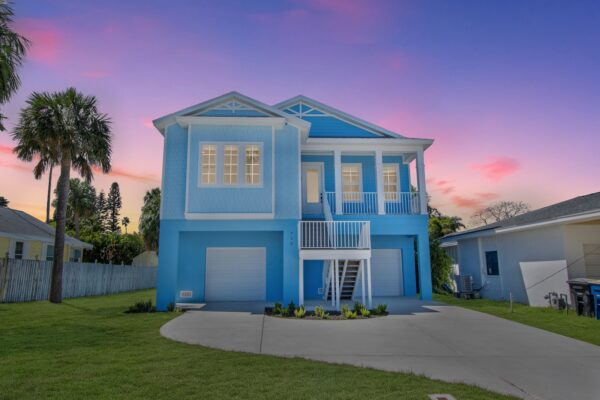 A Beautiful Elevated Home in Blue and White in St. Petersburg with Hurricane-Resistant Features by WinWay Homes