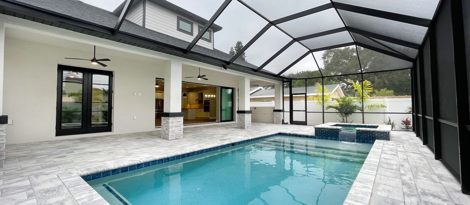 Custom pool with pavers and enclosed