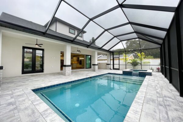 Custom pool with pavers and enclosed