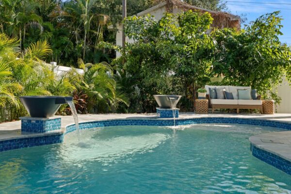 WinWay Homes Backyard Pool with Water Bowls, Tropical Landscaping, Curved Pool Edge & Resort-Style Outdoor Living