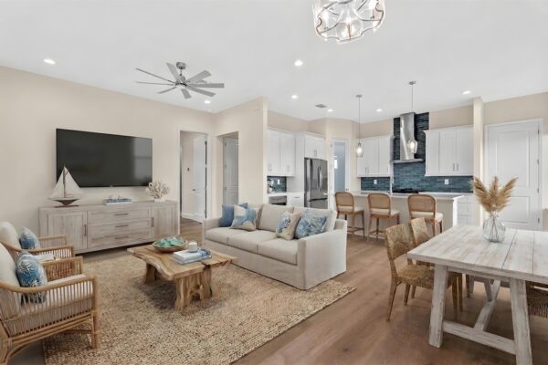 WinWay Homes Open Concept Living Area and Eat-in Kitchen in White and Neutral Tones with Blue Accent Colors
