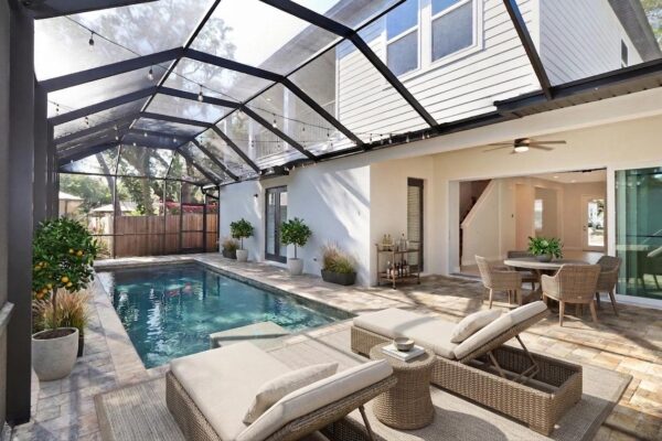WinWay Homes Screened Pool Patio with Covered Dining Area, Lounge Seating, Paver Decking & Two-Story Rear Exterior