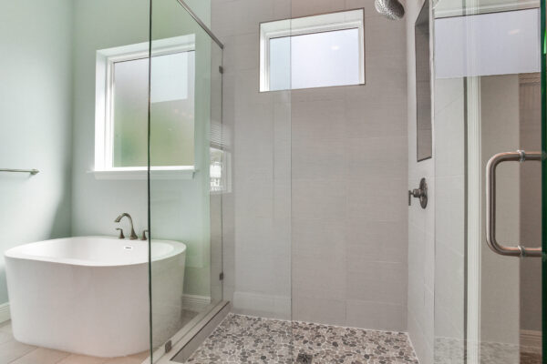 New WinWay Homes Spa Bathroom with Freestanding Tub, Glass Shower with Mosaic Tile Flooring and Small Picture Window