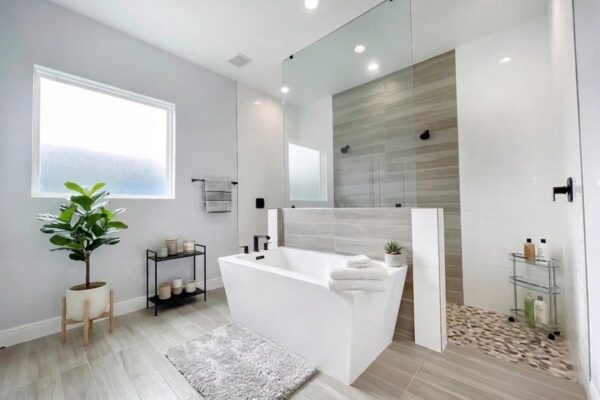 WinWay Homes Spa Bathroom With Freestanding Tub, Walk-In Glass Shower, Light Gray Tile, Pebble Shower Floor & Frosted Window