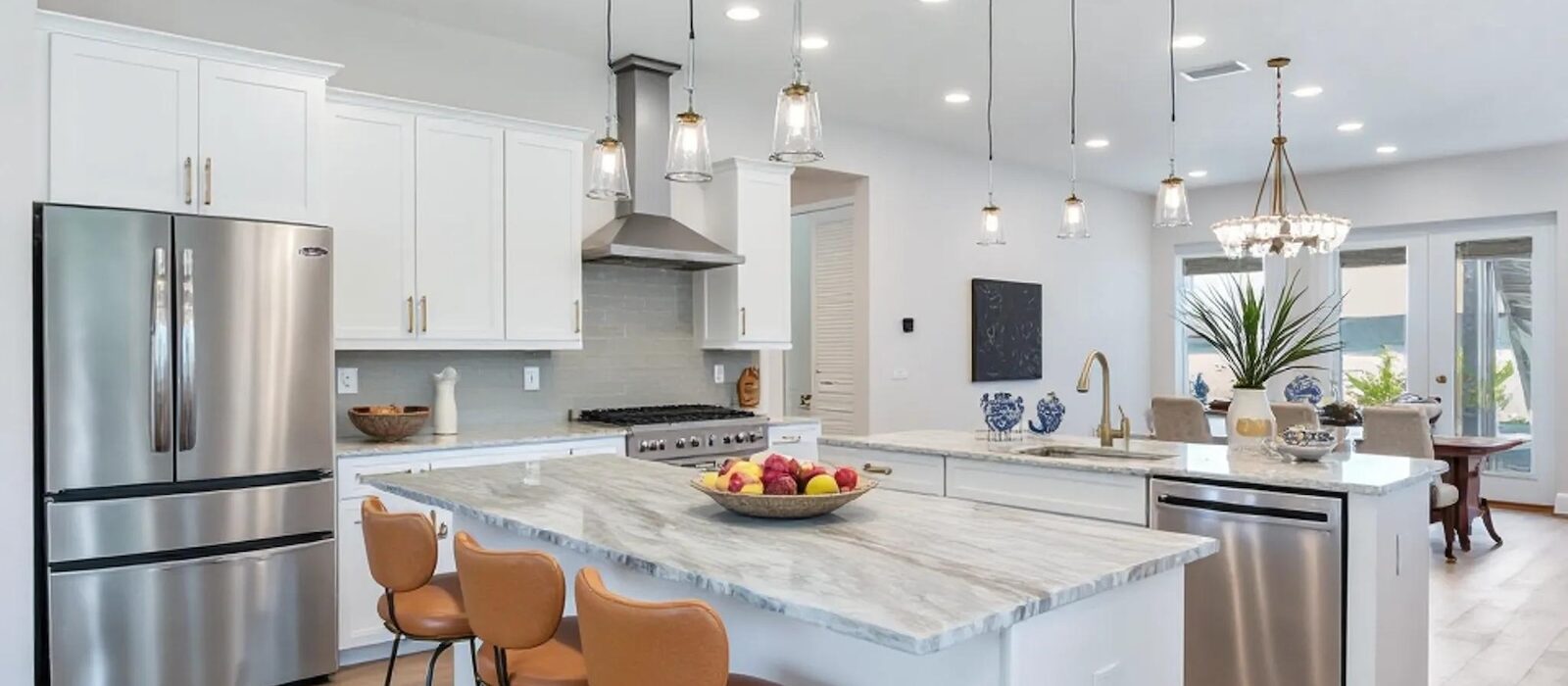 Beautiful Kitchen with Custom Lighting and Contemporary Appliances Designed for Energy Efficiency