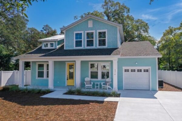 WinWay Homes 2-Story Coastal Cottage with Aqua Siding, Yellow Front Door, White Porch Columns & Attached Garage