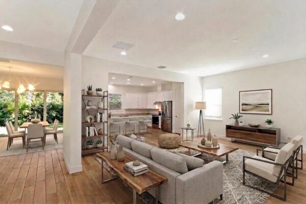 WinWay Homes Living and Dining Area with Open Kitchen, Neutral Furnishings, Wood-Look Flooring & Open Layout