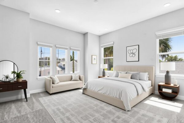 WinWay Homes Primary Bedroom With Light Gray Walls, Multiple Windows, Neutral Furnishings, Light Carpet & Modern Coastal Style