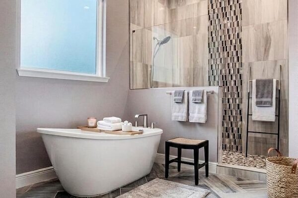 WinWay Homes Spa Bathroom with Freestanding Tub, Mosaic Shower Wall, Gray Tile Flooring & Glass Shower Enclosure
