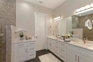 WinWay Homes Double Vanity with White Cabinetry, Large Mirror, Gray Tile Walls & Quartz Countertop