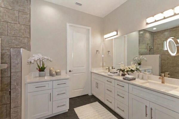 WinWay Homes Double Vanity with White Cabinetry, Large Mirror, Gray Tile Walls & Quartz Countertop