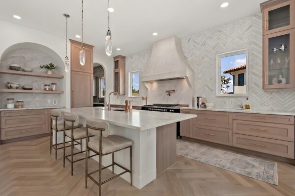 Stunning WinWay Open Kitchen in Neutral Wood Tones with Large Island, Hood, and Double Windows
