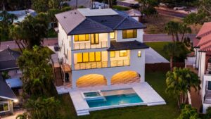 Stunning Multi-Story Elevated Home with Night Lighting, Archways and a Pool by WinWay Homes in St. Petersburg, Florida